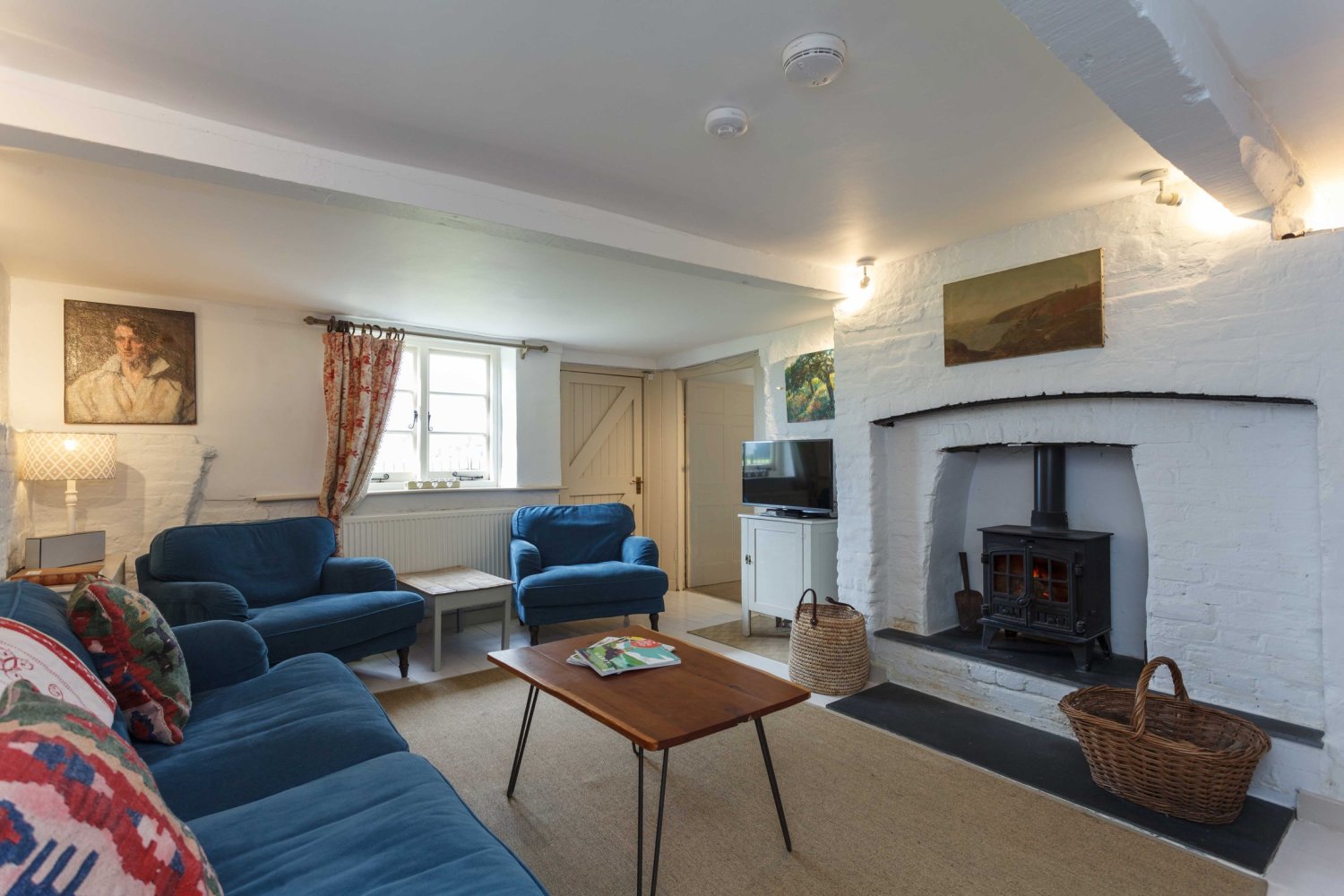 Apple Cottage lounge with wood burner.jpg