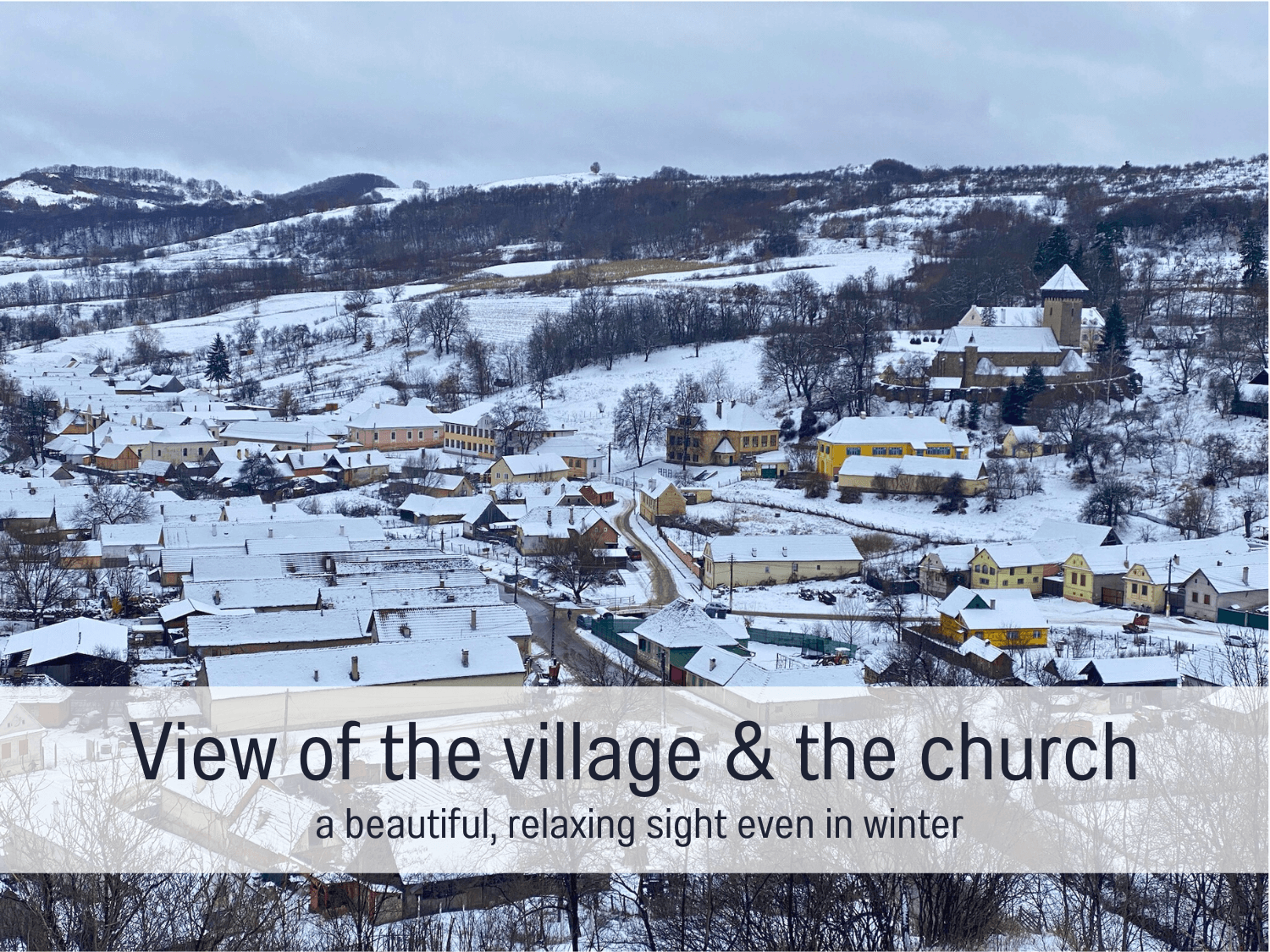 Blockhaus Malmkrog_View of the village & the church_snow.png