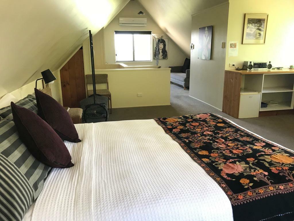 French Cottage_The Loft, queen bed, ensuite, loungeroom with sofa bed, TV.jpg